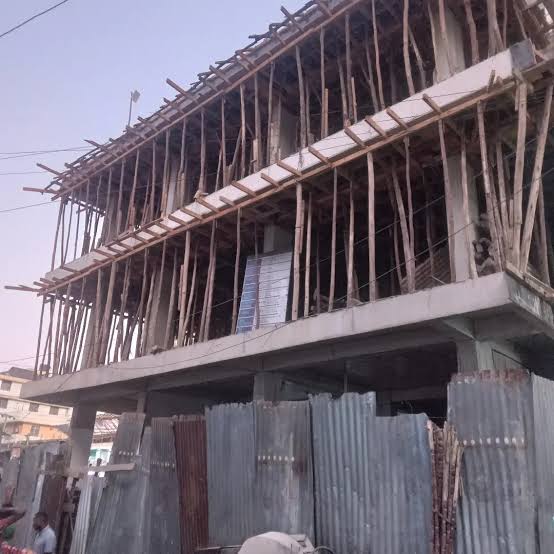 Multi-storey concrete building with timber scaffolding